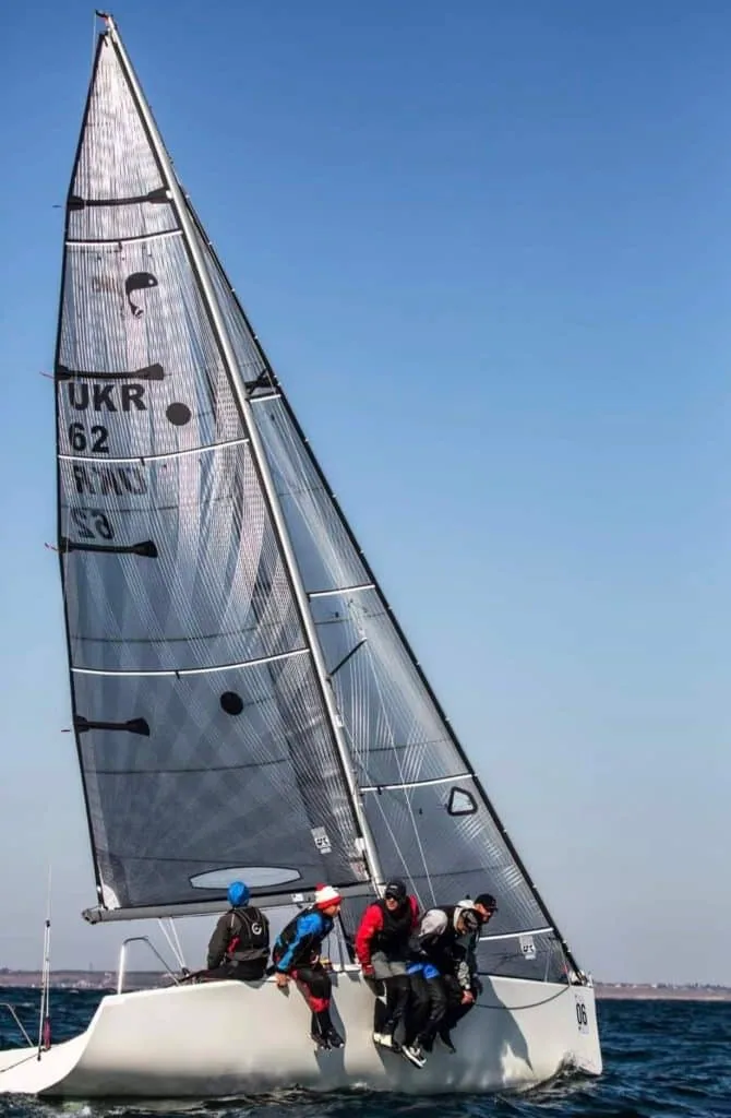Black Sea Pirates' Platu 25 UKR 62 sailing upwind under grey X-Drive® sails, crew hiking