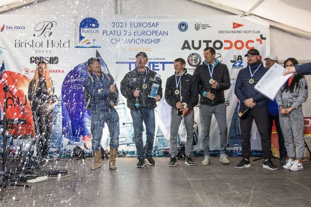 Champagne celebration on the podium at the 2021 Platu 25 European Championship