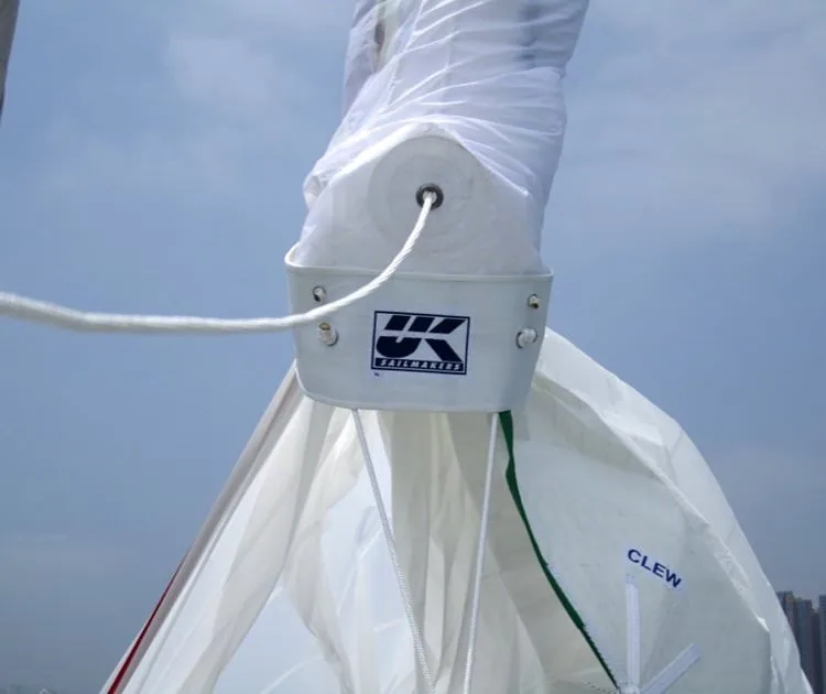 Close-up of a UK Sailmakers dousing sock collar with the spinnaker's clew label visible