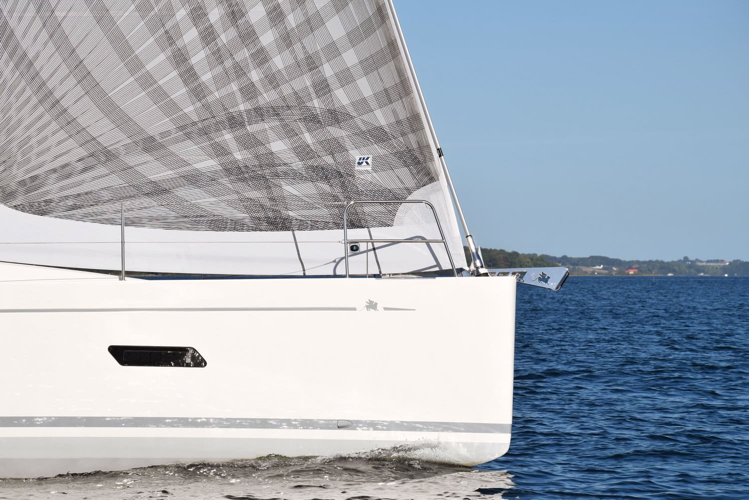 Bow view of an Italia 12 under a grey plaid-patterned X-Drive® genoa