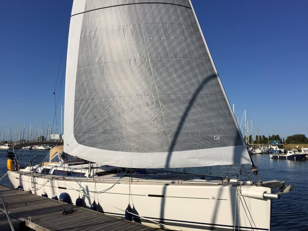 Furled X-Drive® genoa with grey UV sun cover on a Dufour 525 at the dock