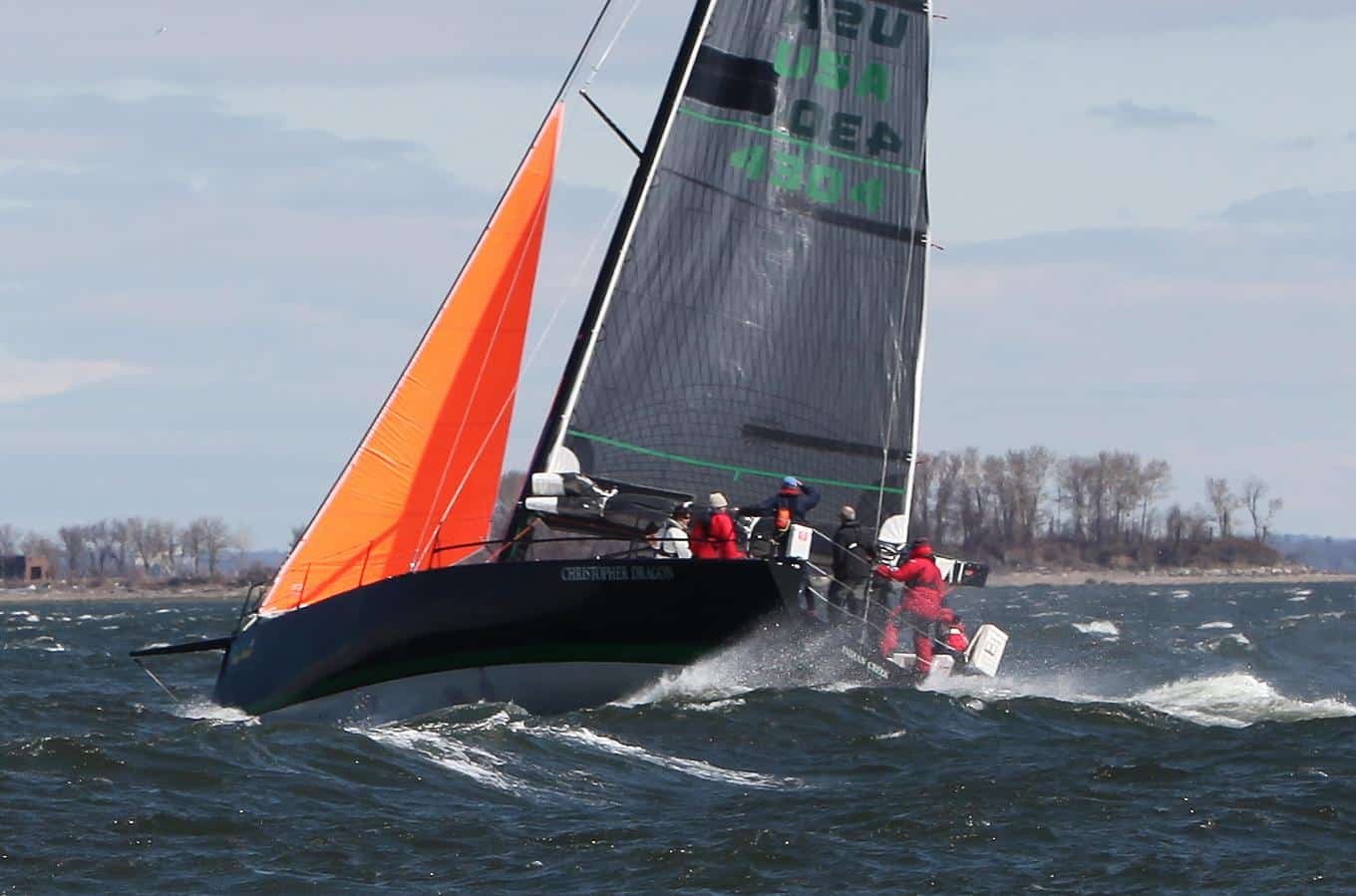A boat sailing in heavy weather under storm canvas