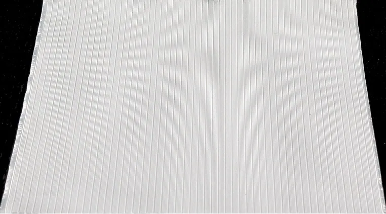Close-up of Voyager cloth, a woven polyester and UHMWPE fabric with a ribbed texture