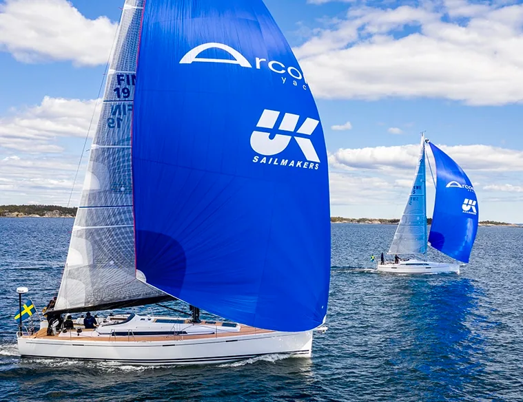 Arcona yacht flying a custom-painted UK Sailmakers spinnaker