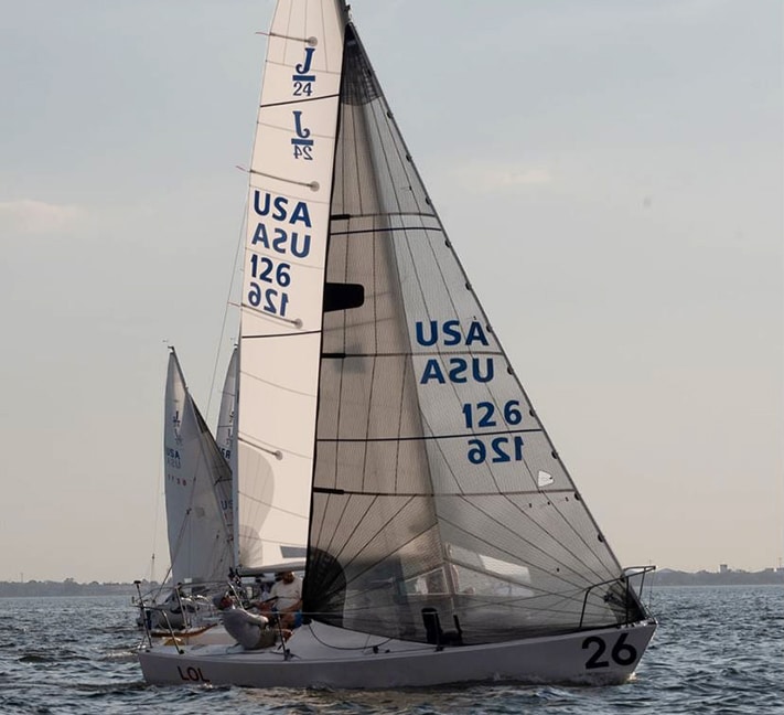 J/24 sailboat USA 126 racing upwind under full sail