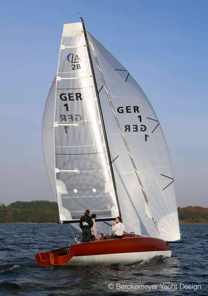 GER 1 sloop under mainsail and jib, leech telltale chevron markers visible