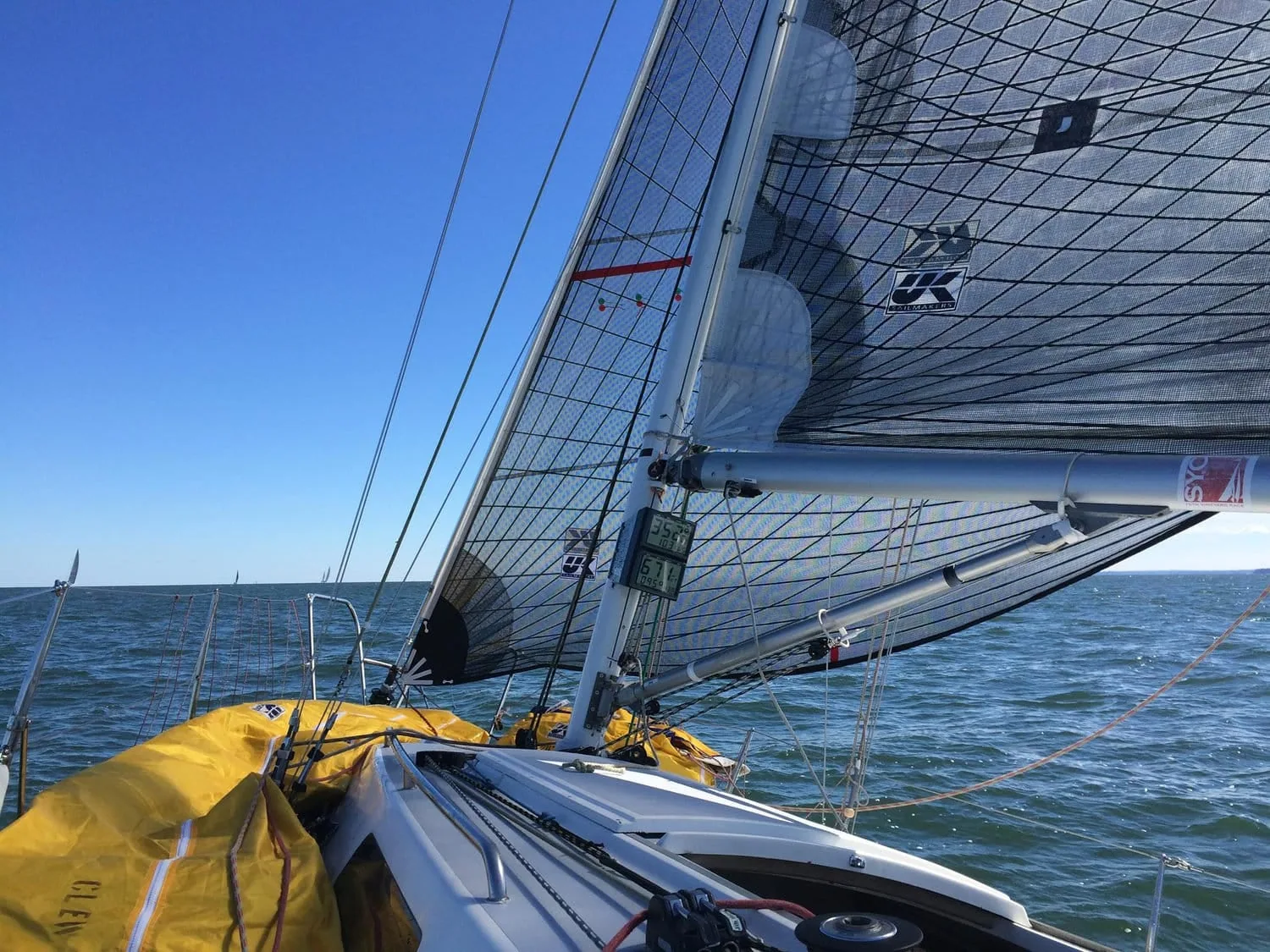Diagram labeling a spinnaker's sheet, guy, lazy sheet and lazy guy lines