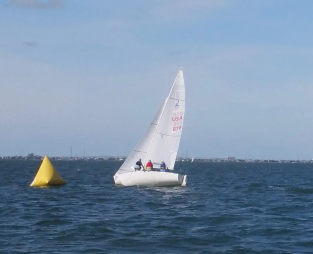 J/22 sail number USA 275 rounding a yellow mark during J/Fest Southwest