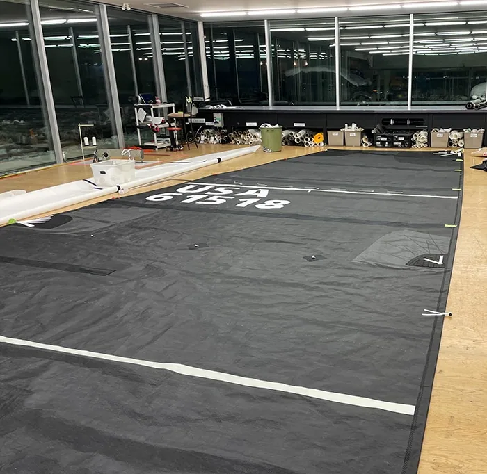 Malolo's Titanium mainsail laid out flat on the loft floor for finishing