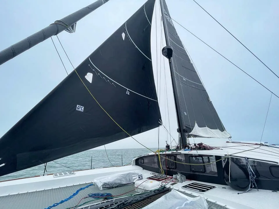 Malolo's J2 headsail set and trimmed, viewed from the catamaran's deck
