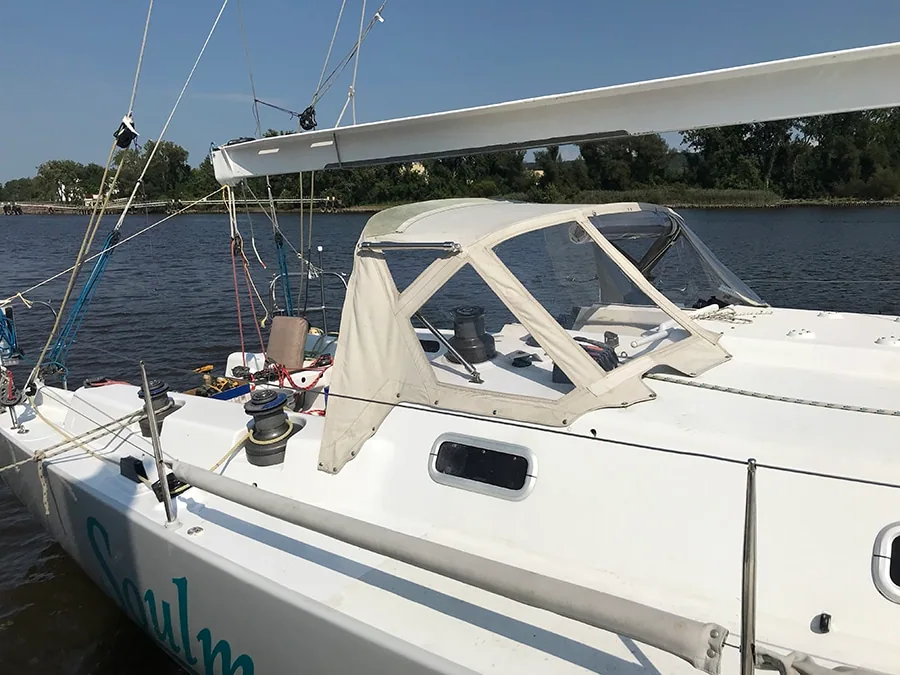 Soulmates' white dodger and cockpit enclosure viewed from the side deck
