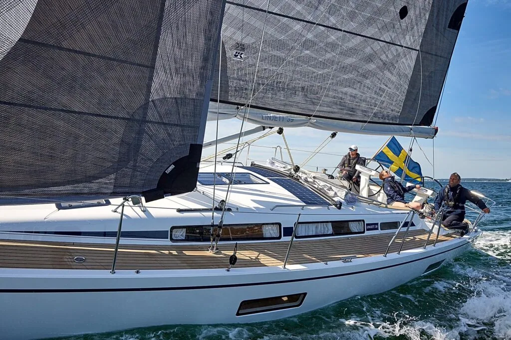 Close leeward view of a Linjett 39's X-Drive® mainsail and crew trimming