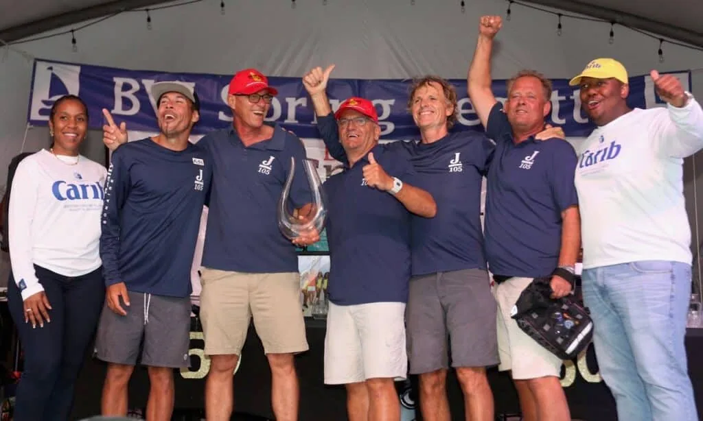 Jenk crew celebrates on stage with their trophy at BVI Spring Regatta