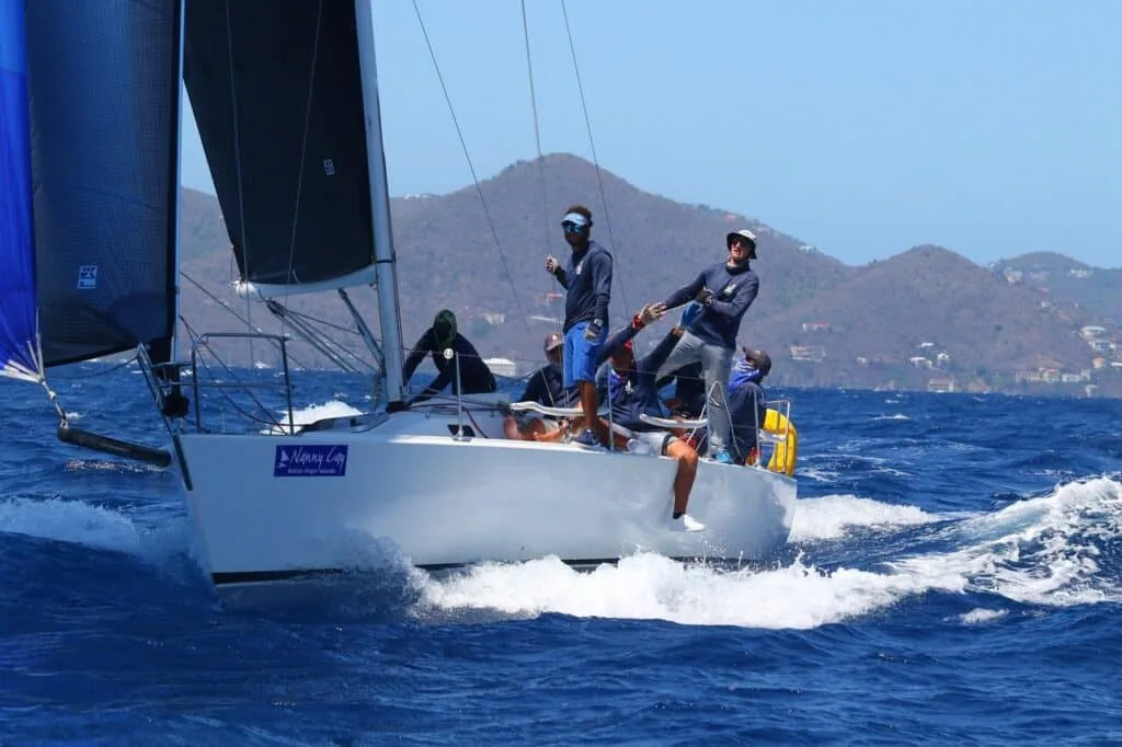 J/105 Jenk surges downwind under a dark asymmetric spinnaker in the BVI