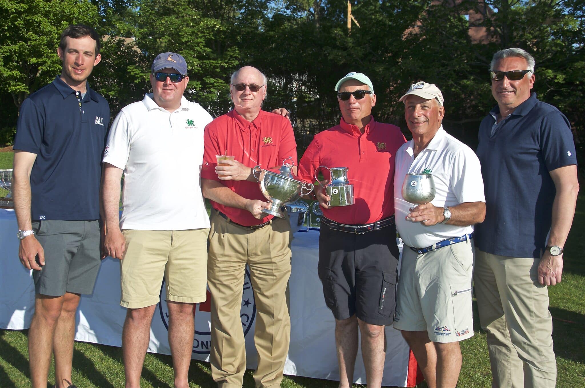 Christopher Dragon crew holds their Block Island Race trophies