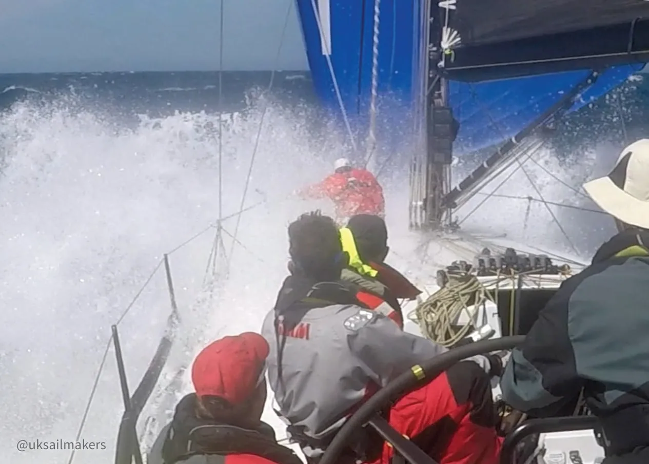 Wave crashes over the bow during UK Sailmakers heavy-weather crew training