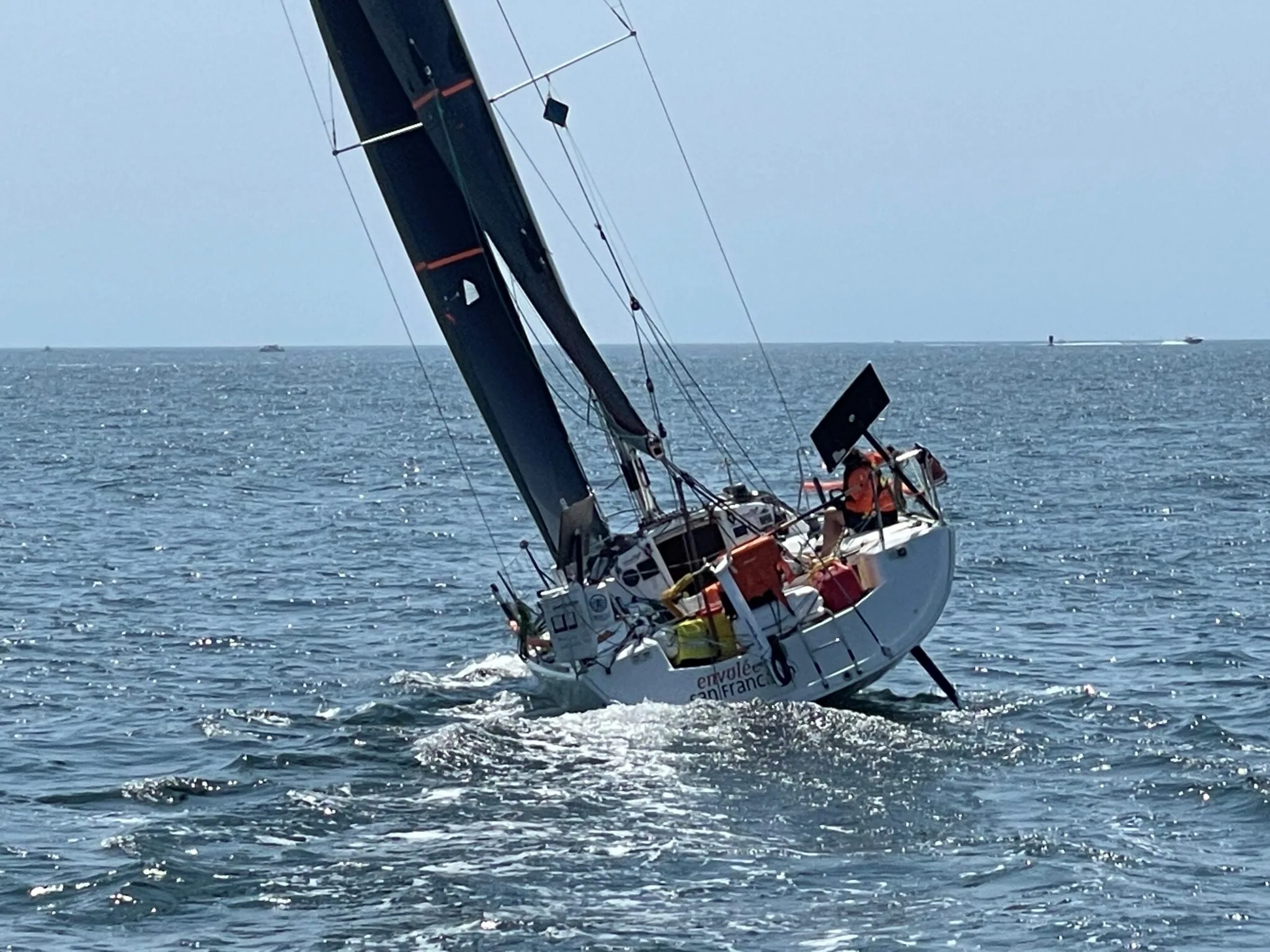 Boat heels hard under black sails during Leg 1 of the 2023 Bermuda 1-2