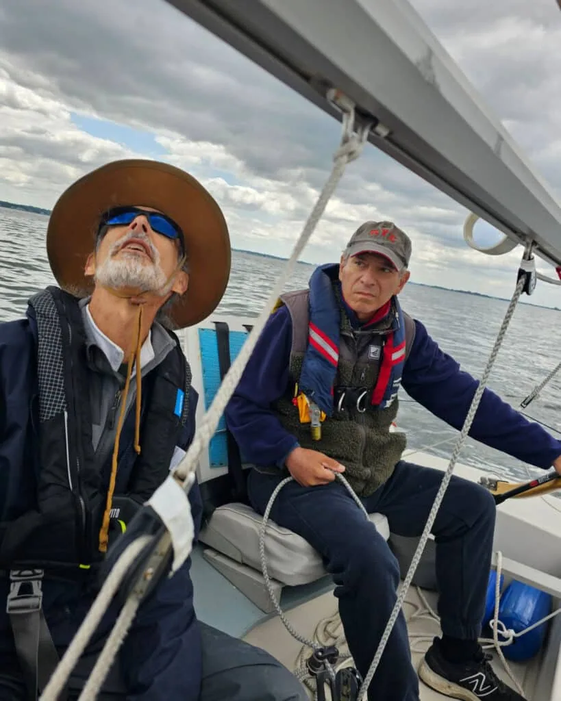 Adam Loory and Kory Breitel aboard a dinghy at Robie Pierce Regatta