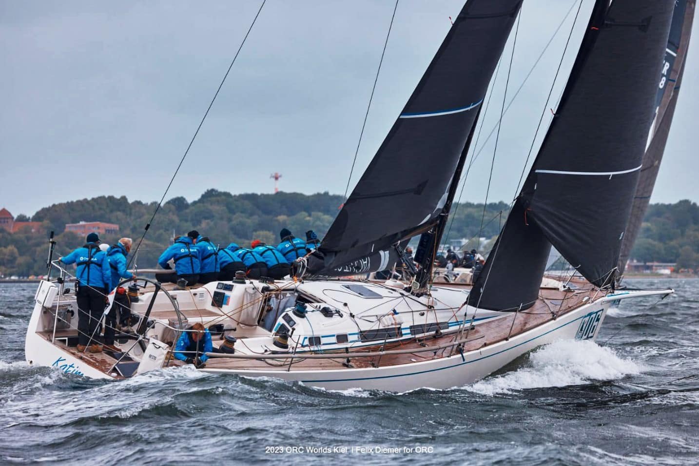 Swan 45 KATIMA's crew hikes out in blue gear racing upwind at ORC Worlds in Kiel
