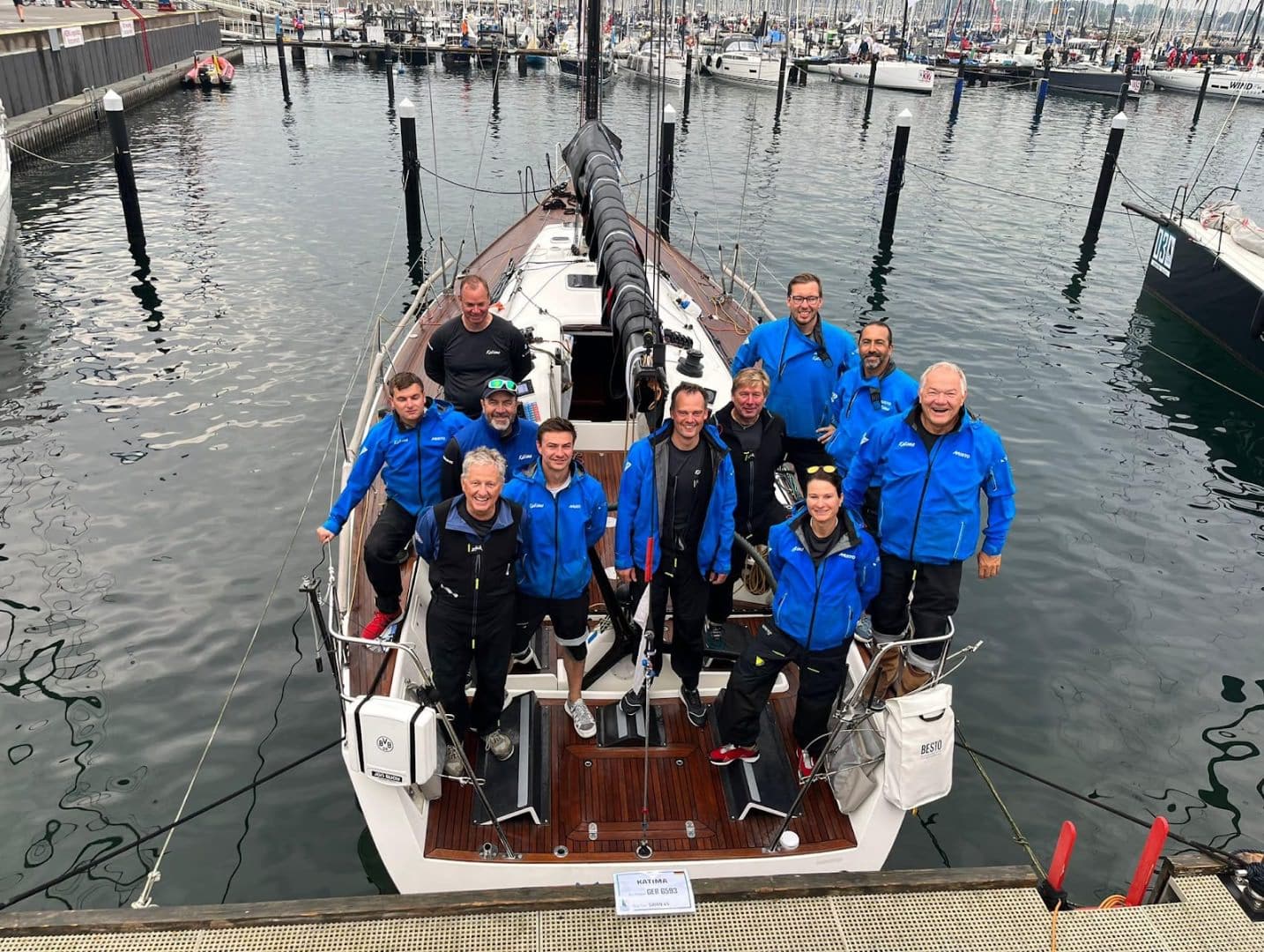 Swan 45 KATIMA crew poses together on the dock at ORC Worlds in Kiel