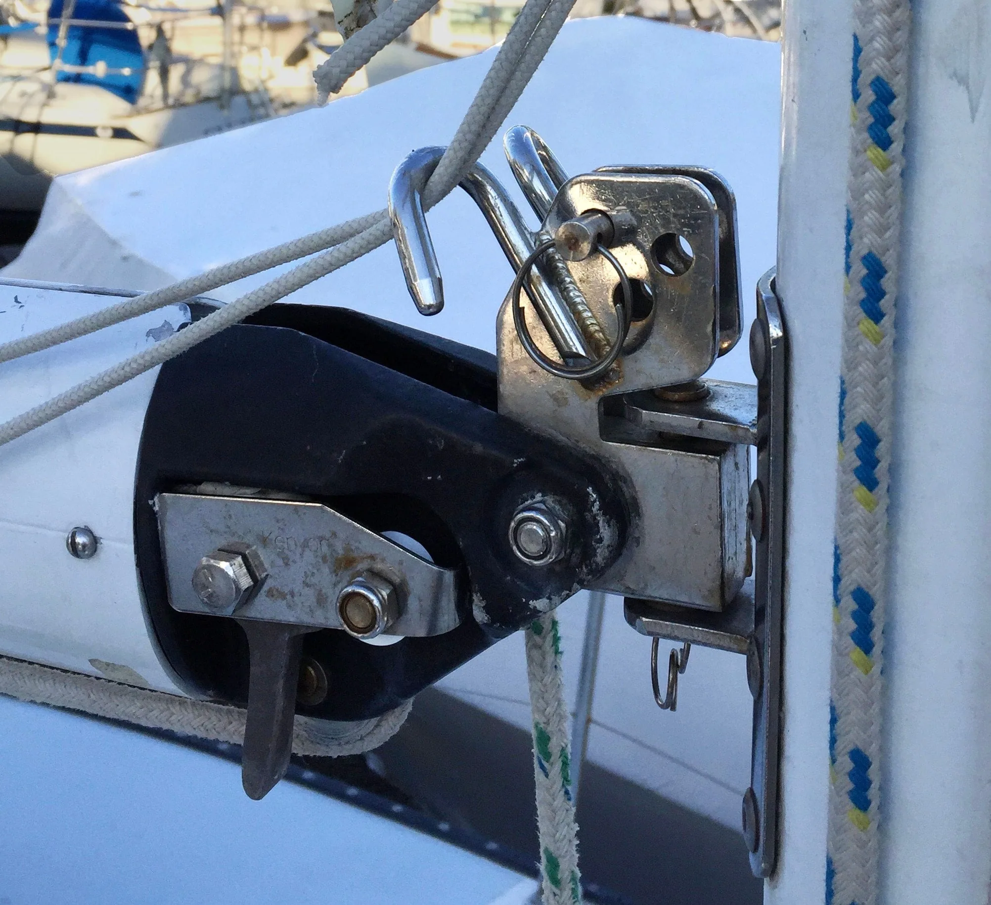 Stainless steel reef hook, or reef horn, fitted at the boom's gooseneck