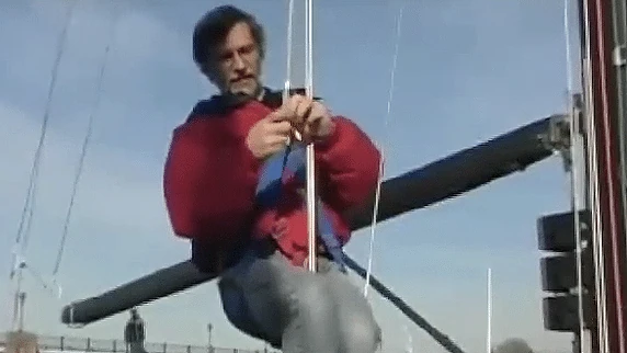 Sailor sighting up the mast and forestay to check that the rig is centered