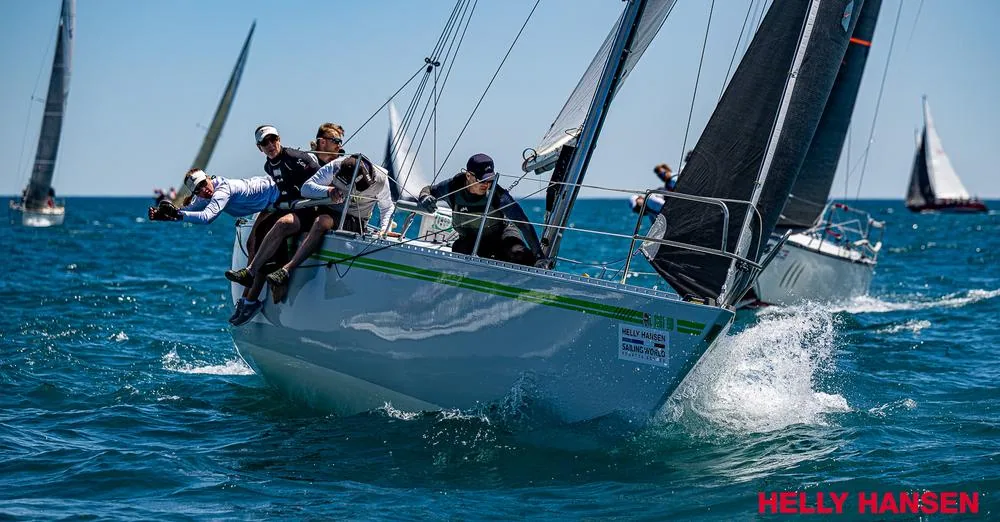 Tartan 10 ERICA hiking hard upwind with crew leaning out over the rail