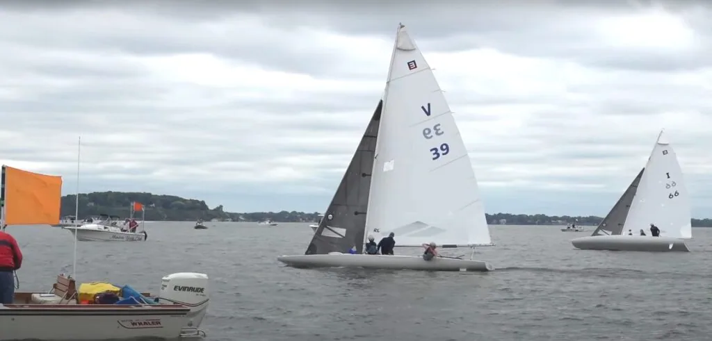 E Scow fleet rounding a mark on Lake Michigan, sail number 39 leading