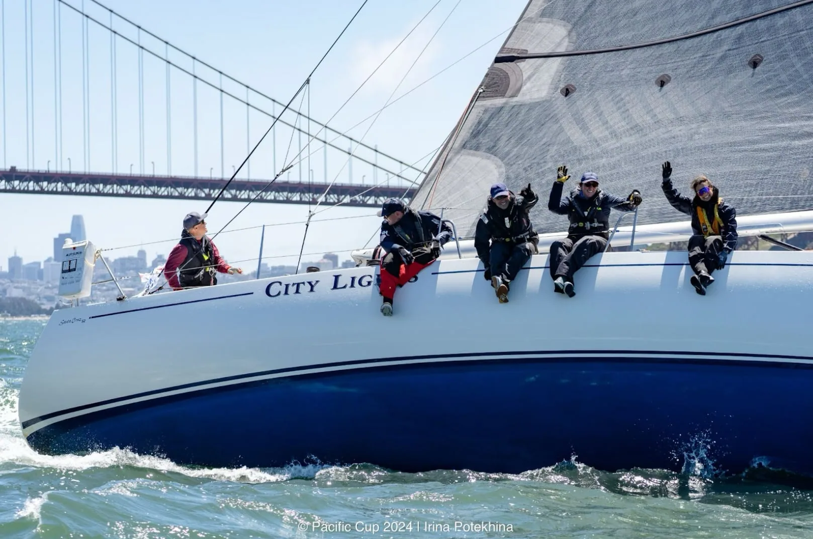 Santa Cruz 52 CITY LIGHTS passing the Golden Gate Bridge with crew waving