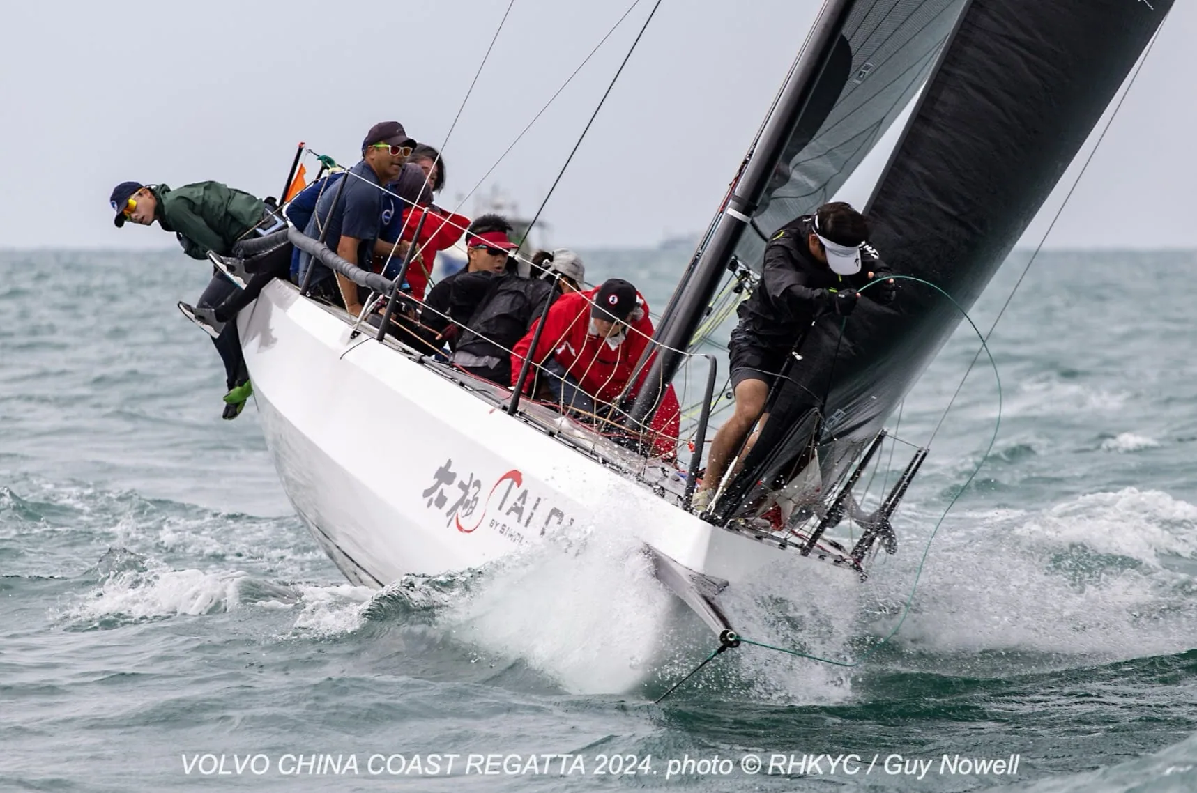 Cape 31 TAI CHI heels hard with red-clad crew hiked out at the China Coast Regatta.