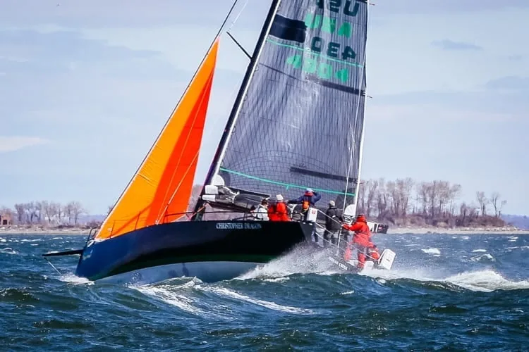 A boat sailing in 40 knots under a storm jib and a deeply reefed main