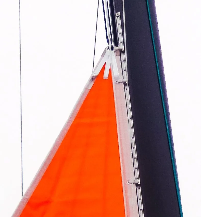 Two reinforced slides webbed onto the head of a UK Sailmakers storm trysail