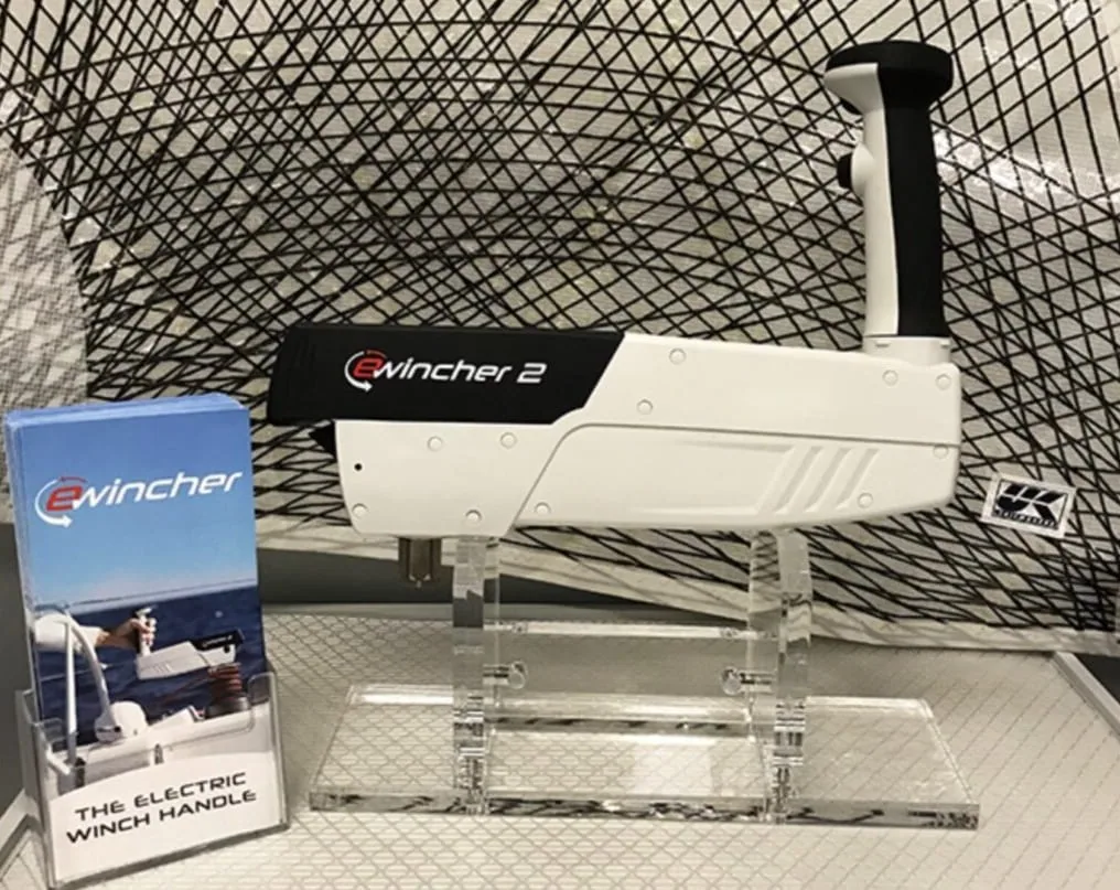 eWincher 2 electric winch handle on display next to its retail packaging.