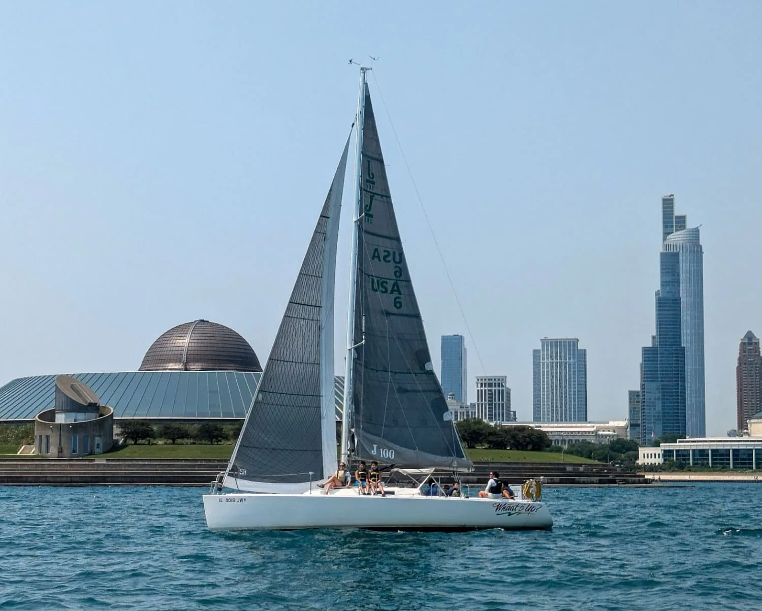 J/100 WHAAT'S UP sailing close-hauled off the Chicago skyline
