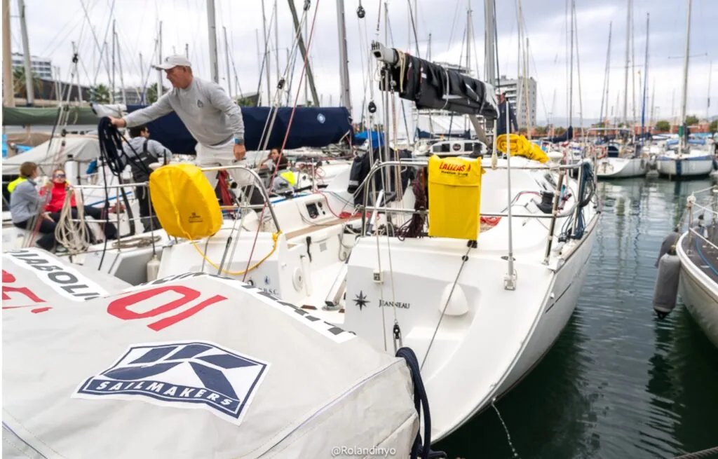 DIABOLIC docked in the marina with a UK Sailmakers Belgium sailbag on deck