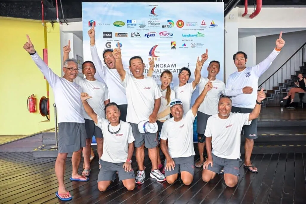 CHAR CHAN crew celebrating at the Royal Langkawi regatta prizegiving