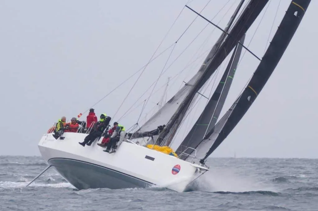 SIRENE reaching hard under a dark mainsail during an offshore race