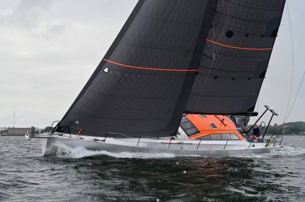 Berckemeyer BM49 heeling hard under dark UK Sailmakers X-Drive® Carbon sails