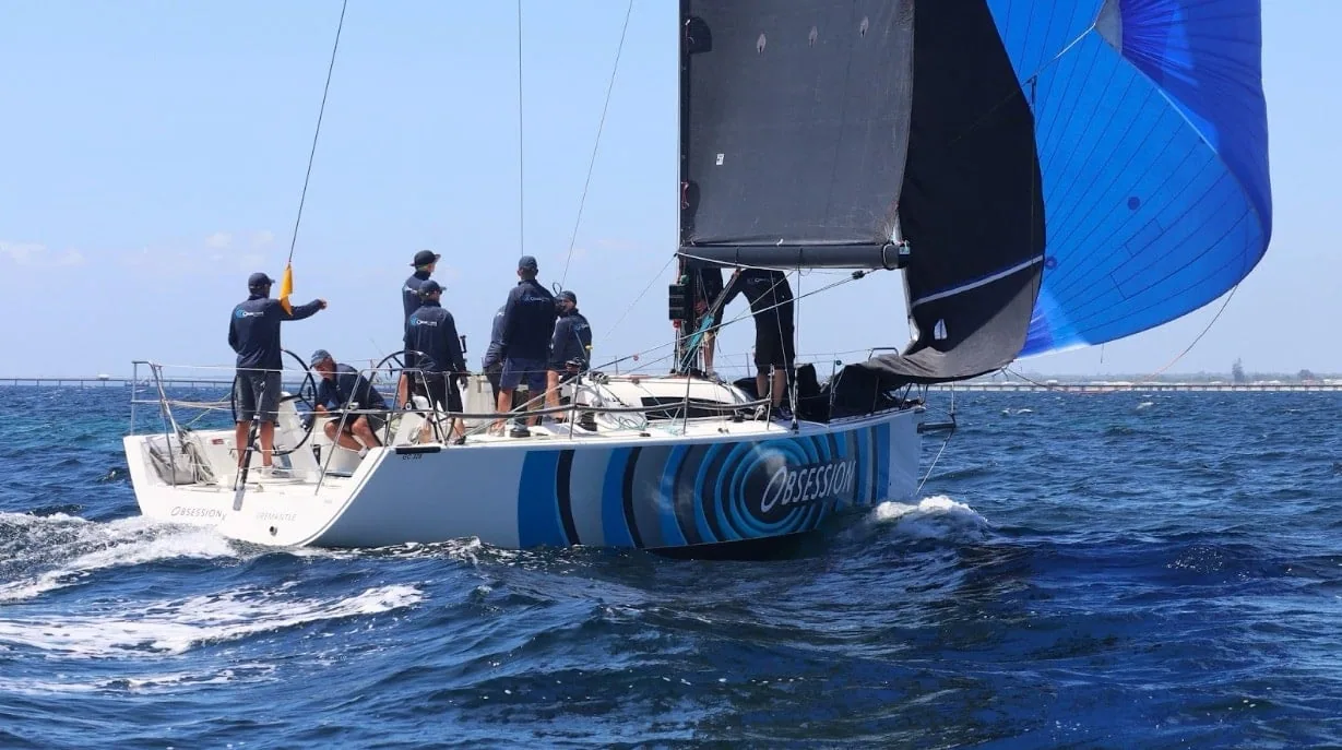 MAT 1245 OBSESSION reaching under a blue spinnaker and dark mainsail at Geographe Bay Race Week