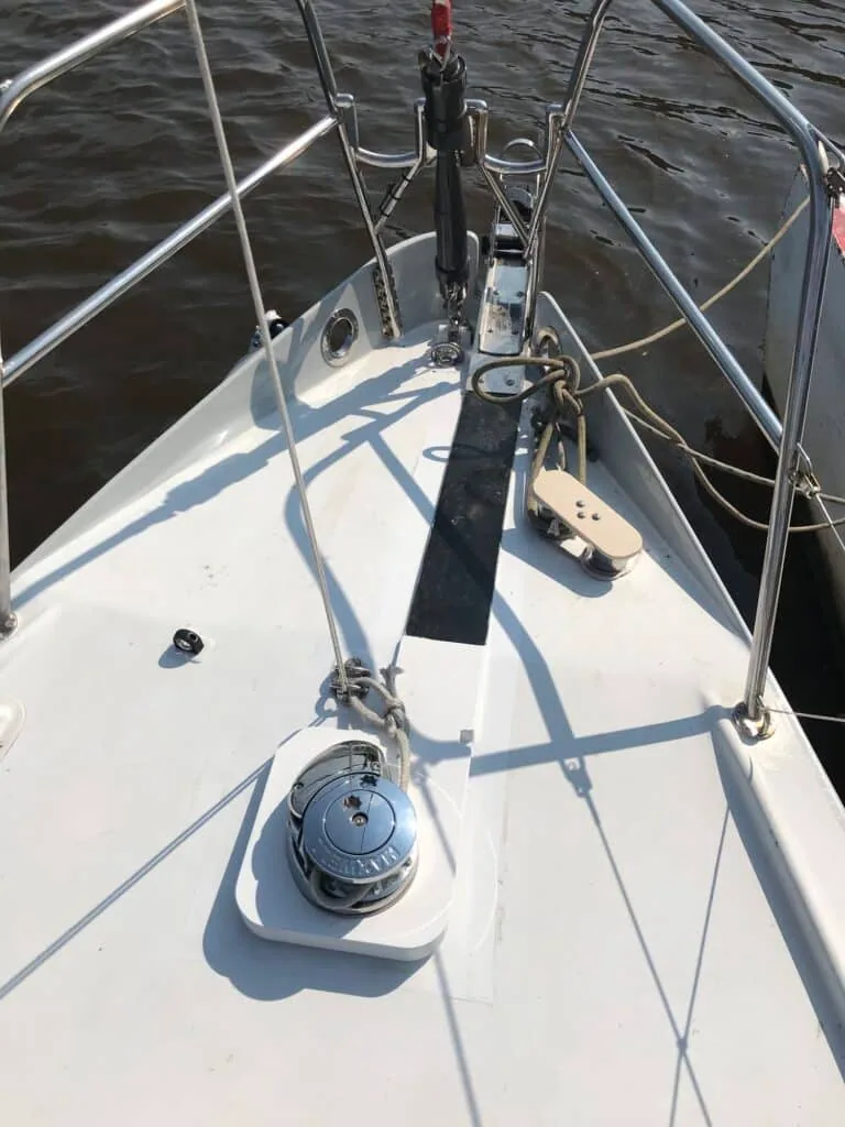 Bow deck of a cruising yacht with the anchor windlass and roller fitting installed