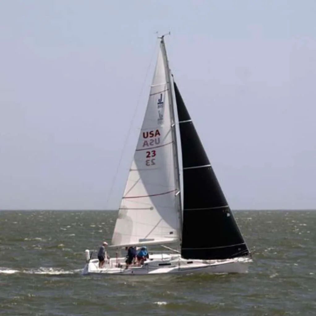 J/105 sail number 23 close-hauled under a white mainsail and dark jib