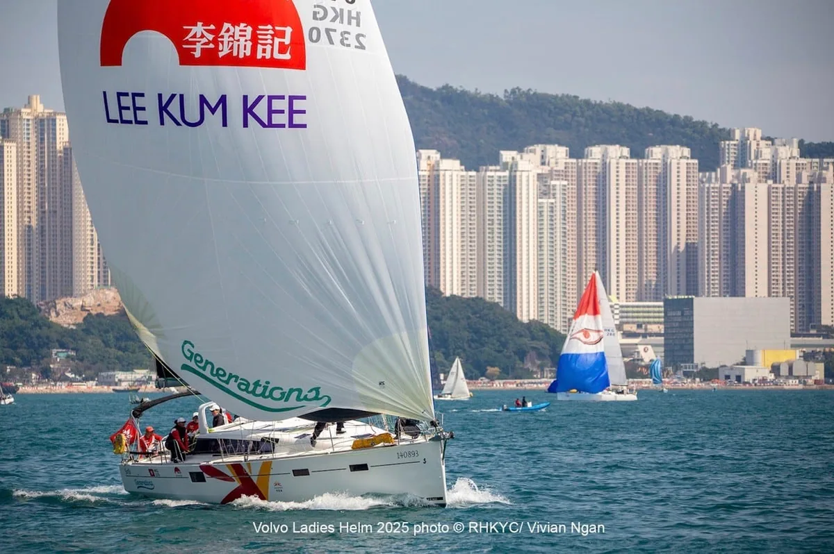 GENERATIONA flying a Lee Kum Kee-branded spinnaker off the Hong Kong skyline