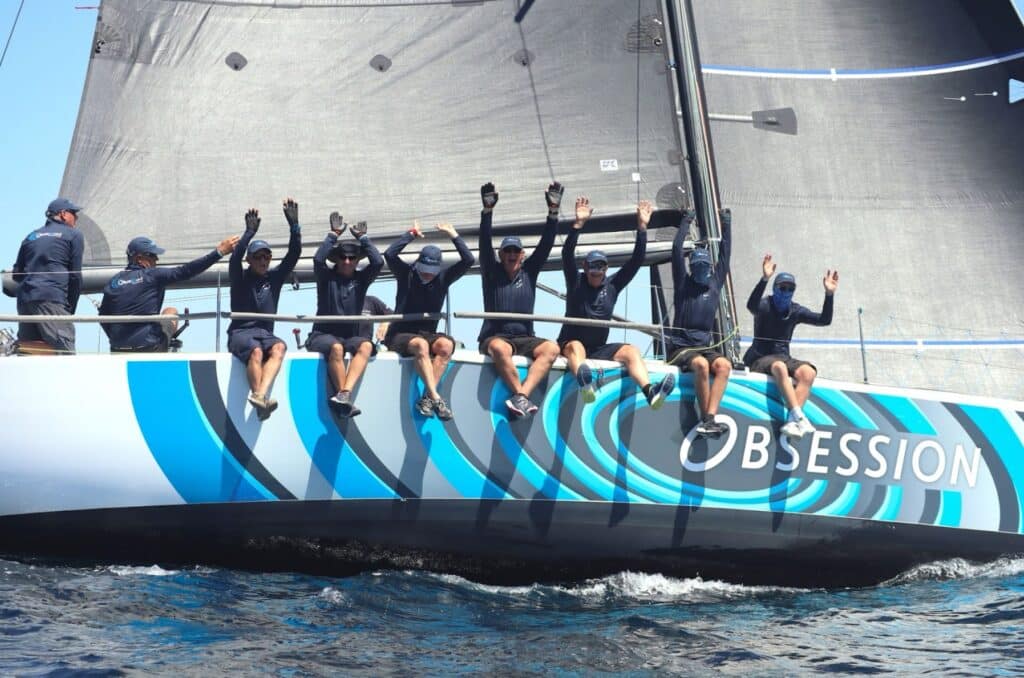 OBSESSION crew celebrates with arms raised at Geographe Bay Race Week