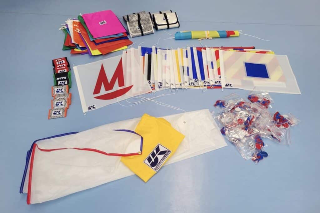 Table of Mirror Worlds prizes from UK Sailmakers South Africa, spinnaker included