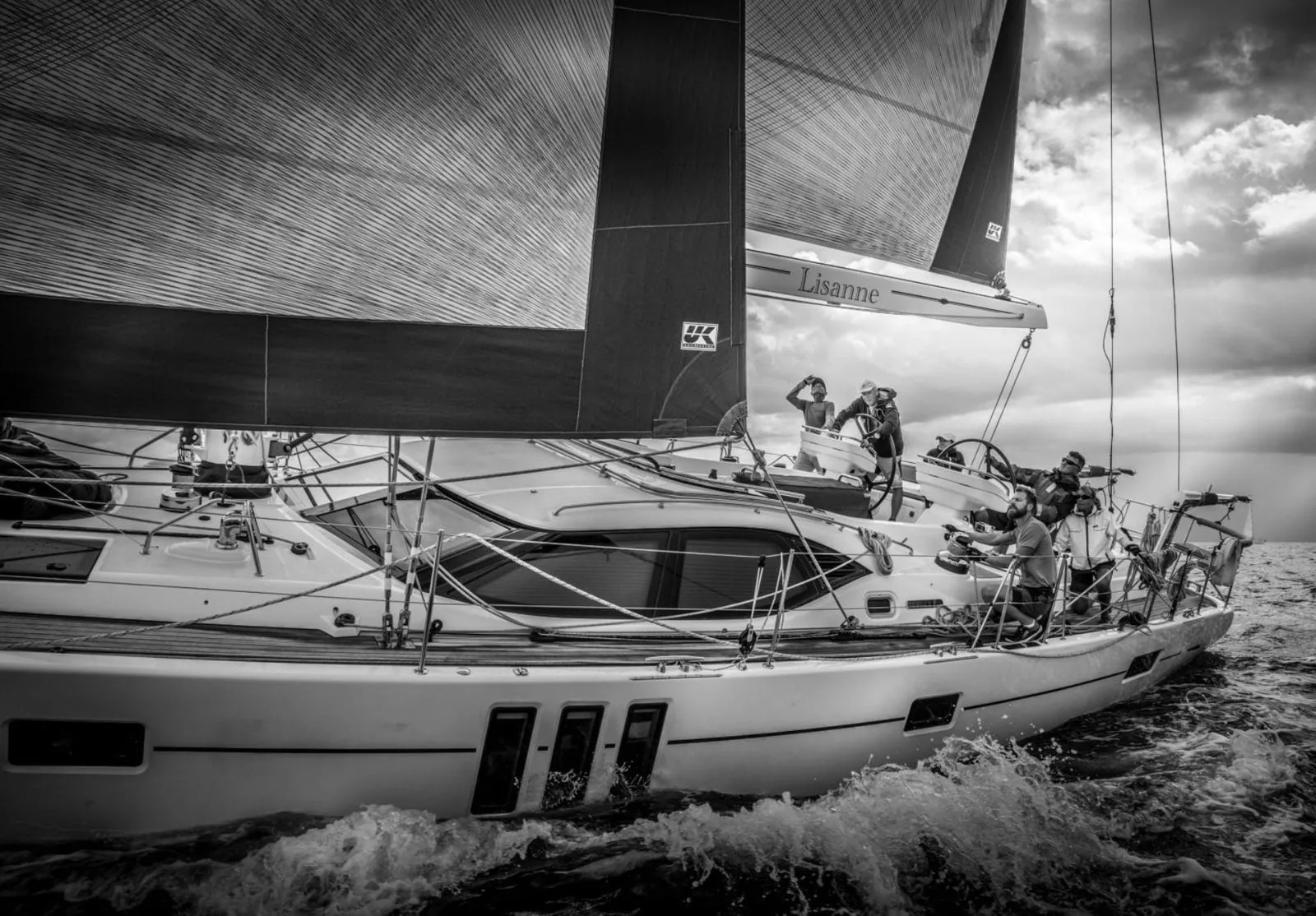 Black-and-white photo of the Oyster 575 Lisanne heeled under an X-Drive® mainsail and genoa