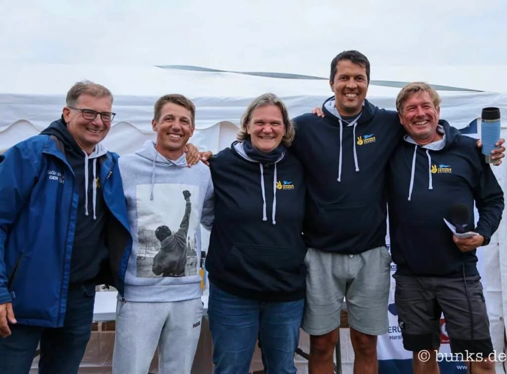 L30 fleet racing downwind under colorful spinnakers, GER sail numbers visible