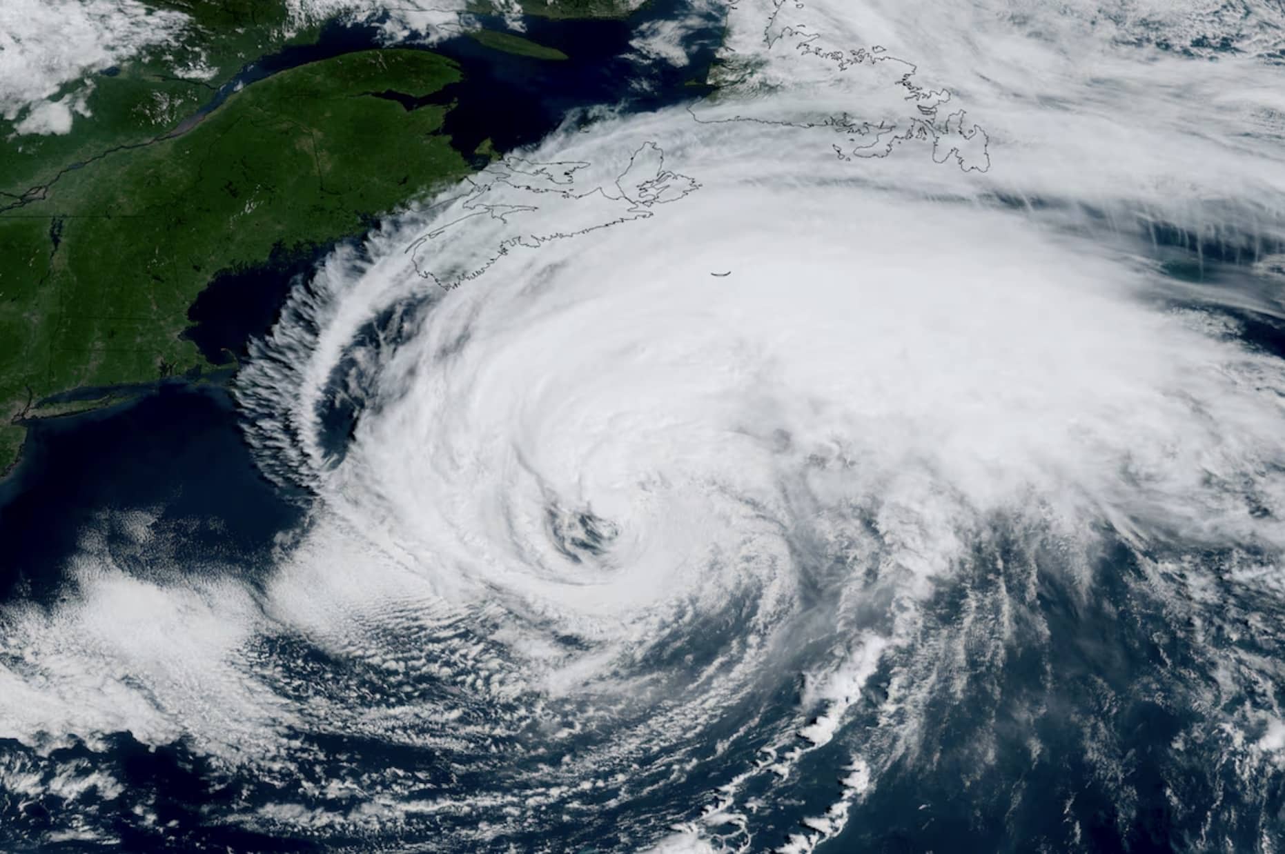Satellite image of a hurricane's swirling cloud bands approaching the Atlantic coast