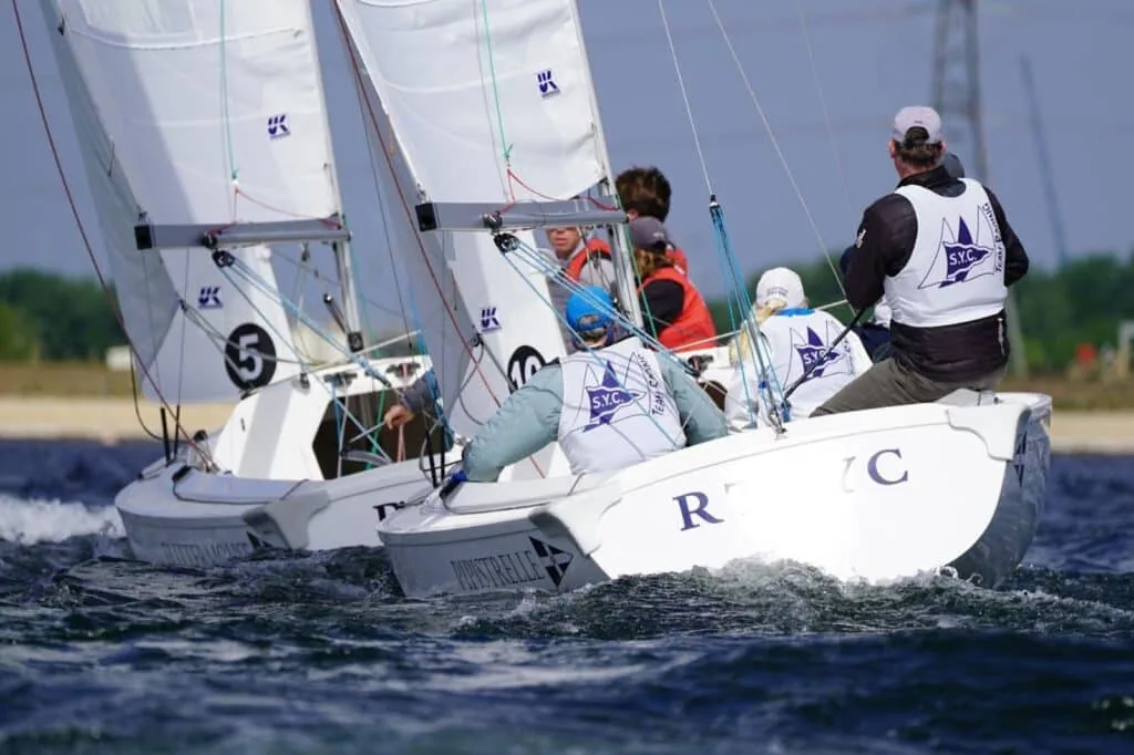 Two RTYC keelboats overlapped closely while team racing on open water