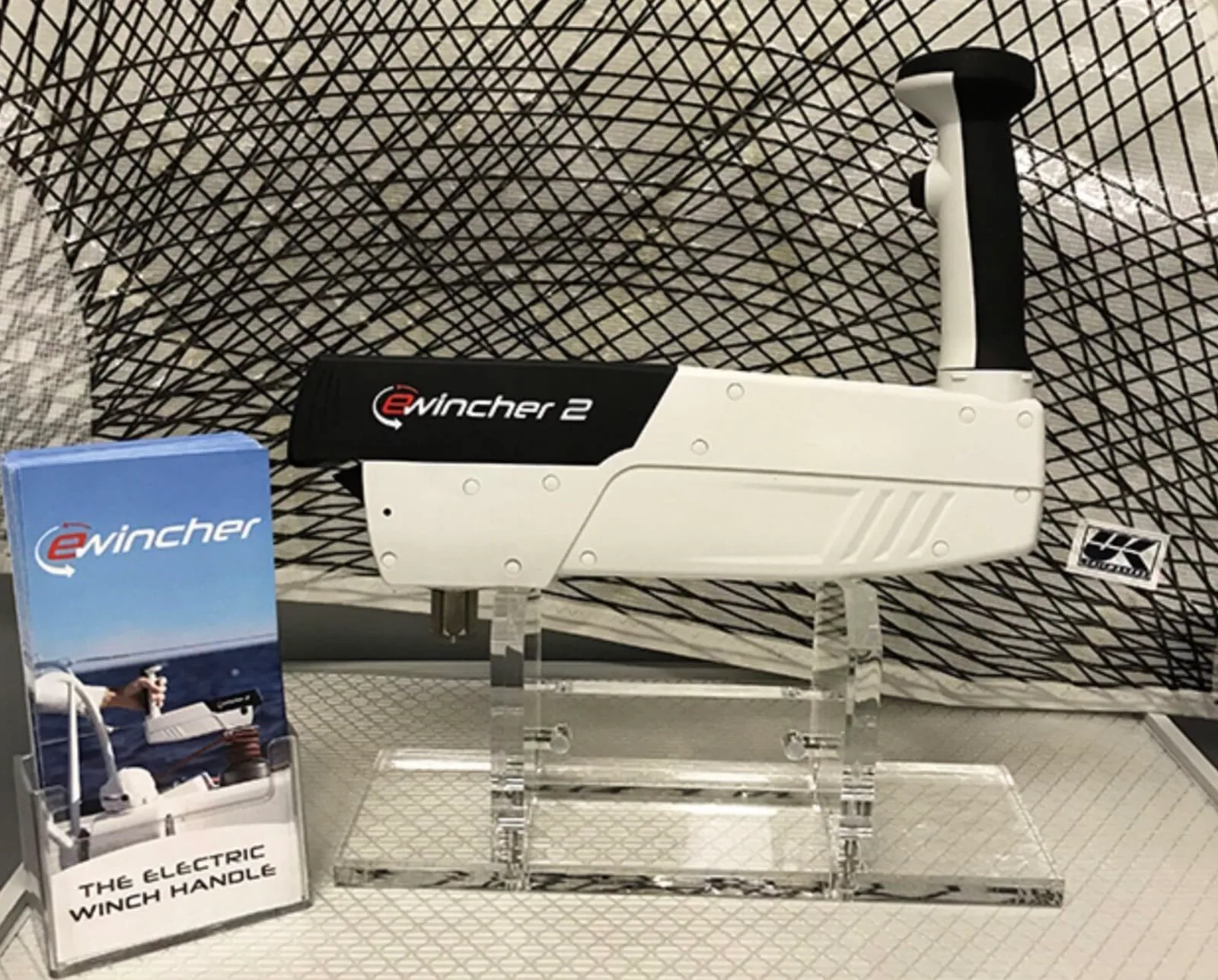 Ewincher 2 electric winch handle on a display stand next to its retail box