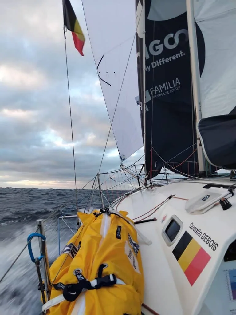 Cockpit view of ODIGO offshore, 'Quentin DEBOIS' and the Belgian flag on the stern